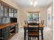 Dining room features an antique china cabinet, table set, and window at 5865 Forest Point Rd Rd, Raleigh, NC 27610