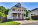 Charming two-story home boasts dual porches, stone accents, and mature landscaping at 5865 Forest Point Rd Rd, Raleigh, NC 27610