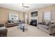Inviting living room with a cozy fireplace and comfortable seating at 5865 Forest Point Rd Rd, Raleigh, NC 27610