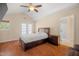 Spacious main bedroom with vaulted ceilings, French doors to the backyard, and hardwood floors at 5865 Forest Point Rd Rd, Raleigh, NC 27610