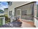 View of the screened porch with access to deck at 5865 Forest Point Rd Rd, Raleigh, NC 27610