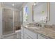 Bathroom with a granite countertop, tiled floors and a glass-door shower at 60 Hartwood Ln, Youngsville, NC 27596