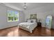 Bright bedroom with hardwood floors, a large window, and stylish decor at 60 Hartwood Ln, Youngsville, NC 27596