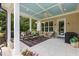 Relaxing covered porch with outdoor seating and ceiling fan, perfect for entertaining at 60 Hartwood Ln, Youngsville, NC 27596