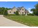 Beautiful home exterior with well-manicured lawn, mature landscaping, and classic design at 60 Hartwood Ln, Youngsville, NC 27596