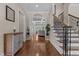Inviting foyer with hardwood floors, a staircase, and views into the living room at 60 Hartwood Ln, Youngsville, NC 27596
