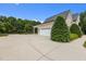 Spacious garage with a driveway and manicured landscaping at 60 Hartwood Ln, Youngsville, NC 27596