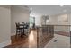 Second floor hallway, with office and sitting areas, hardwood flooring, and iron railings at 60 Hartwood Ln, Youngsville, NC 27596