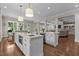 Open concept kitchen with two islands, granite countertops, and seamless integration into the dining and living areas at 60 Hartwood Ln, Youngsville, NC 27596