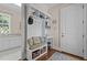 Mudroom with custom built-in bench, storage, and decor at 60 Hartwood Ln, Youngsville, NC 27596