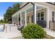 Outdoor living space with a covered porch, pool, and barbecue area at 60 Hartwood Ln, Youngsville, NC 27596