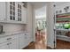 Charming pantry with shelving, granite counters, and dining room view at 60 Hartwood Ln, Youngsville, NC 27596