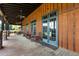 Covered porch with rocking chairs overlooking a serene lake and trees at 60 Hartwood Ln, Youngsville, NC 27596