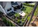 An aerial view of the backyard with lush landscaping and a patio at 604 Dappled Pine Ave, Durham, NC 27713