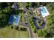 Community aerial view showcasing the pool, tennis courts, clubhouse, and surrounding neighborhood at 604 Dappled Pine Ave, Durham, NC 27713