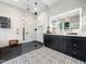 This bathroom features glass-enclosed shower, modern vanity, and patterned tile floors at 604 Dappled Pine Ave, Durham, NC 27713