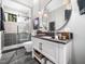 This bathroom has modern vanity, an oval mirror, and a stylish tiled shower at 604 Dappled Pine Ave, Durham, NC 27713