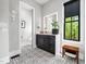 This bathroom has modern vanity, a designer mirror, and patterned tile at 604 Dappled Pine Ave, Durham, NC 27713
