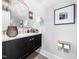 Stylish powder room with modern vanity, elegant lighting, and decorative accents at 604 Dappled Pine Ave, Durham, NC 27713