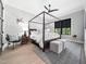 This bedroom features a canopy bed, soft lighting and a stylish ceiling fan at 604 Dappled Pine Ave, Durham, NC 27713
