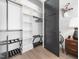 The closet features adjustable shelving and a dark-stained door that complements the room's design at 604 Dappled Pine Ave, Durham, NC 27713
