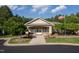 Attractive community clubhouse with well-manicured landscaping and American flag at 604 Dappled Pine Ave, Durham, NC 27713