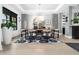 Elegant dining room featuring modern decor, a statement chandelier, and views to the outside at 604 Dappled Pine Ave, Durham, NC 27713