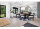 Contemporary dining room with stylish decor, a large mirror, and access to outdoor views at 604 Dappled Pine Ave, Durham, NC 27713