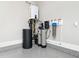 Garage corner showing modern water filtration and heating systems at 604 Dappled Pine Ave, Durham, NC 27713