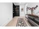 Hallway with hardwood floors and a built-in bookcase doubling as a hidden door at 604 Dappled Pine Ave, Durham, NC 27713