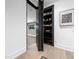 Hidden bookcase door in hallway, revealing a glimpse into another room at 604 Dappled Pine Ave, Durham, NC 27713