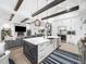 Gourmet kitchen features stainless steel appliances, island, and open living concept at 604 Dappled Pine Ave, Durham, NC 27713