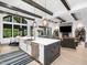 Open floor plan features a modern kitchen and breakfast area with luxury finishes and lighting at 604 Dappled Pine Ave, Durham, NC 27713