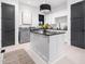 Well-designed laundry room with an island, modern appliances, and stylish cabinets at 604 Dappled Pine Ave, Durham, NC 27713