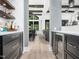 Open concept living area with hardwood floors, modern bar, and sightlines to the great room at 604 Dappled Pine Ave, Durham, NC 27713