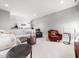 Cozy living room with neutral colors, carpet, plush seating, and stylish decor at 604 Dappled Pine Ave, Durham, NC 27713
