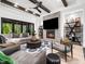 Modern living room features built-in fireplace, large TV, and neutral decor at 604 Dappled Pine Ave, Durham, NC 27713