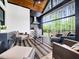Inviting covered outdoor living space with kitchen, grill, and comfortable seating at 604 Dappled Pine Ave, Durham, NC 27713