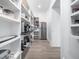 Spacious walk-in pantry with ample shelving, modern appliances, and convenient access to the kitchen at 604 Dappled Pine Ave, Durham, NC 27713