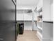 Organized walk-in closet with built-in shelving and storage, plus wood floors at 604 Dappled Pine Ave, Durham, NC 27713