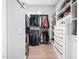 Organized walk-in closet with custom shelves, drawers, and rods for ample storage at 604 Dappled Pine Ave, Durham, NC 27713