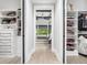 Walk-in closet featuring custom shelving with a view into the main bedroom at 604 Dappled Pine Ave, Durham, NC 27713