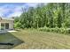 Large backyard with green grass and tree line at back at 605 Hampton Crest Ct, Fuquay Varina, NC 27526