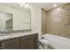 Bathroom with granite countertops, double sinks, tiled backsplash and a tub at 605 Hampton Crest Ct, Fuquay Varina, NC 27526