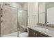 Bathroom with a stone countertop vanity and a glass enclosed shower featuring beige tiling at 605 Hampton Crest Ct, Fuquay Varina, NC 27526