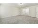 A carpeted bedroom featuring neutral carpet and white walls at 605 Hampton Crest Ct, Fuquay Varina, NC 27526