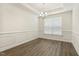 Bright dining room with stylish lighting, hardwood floors, and classic trim, ideal for Gathering gatherings at 605 Hampton Crest Ct, Fuquay Varina, NC 27526