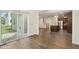 Open concept dining room featuring hard wood floors and sliding glass doors to the outside at 605 Hampton Crest Ct, Fuquay Varina, NC 27526