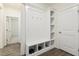 Entryway featuring hardwood floors and a custom shelving and storage unit at 605 Hampton Crest Ct, Fuquay Varina, NC 27526