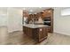 Kitchen with wood cabinets, stainless steel appliances, and a center island with a granite countertop and a modern design at 605 Hampton Crest Ct, Fuquay Varina, NC 27526